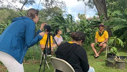 Students in the North Shore Ethnographic Field School conduct interviews with Moki Labra in Waialua, O‘ahu