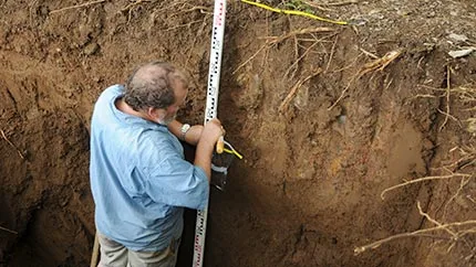 Collecting sediments for paleoenvironmental studies, Mo'orea, Society Islands (French Polynesia).