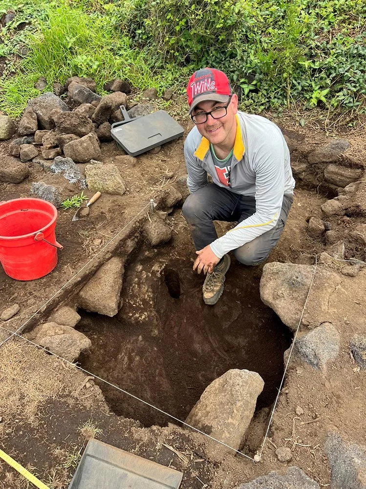 Dr. Seth Quintus excavates a test pit.